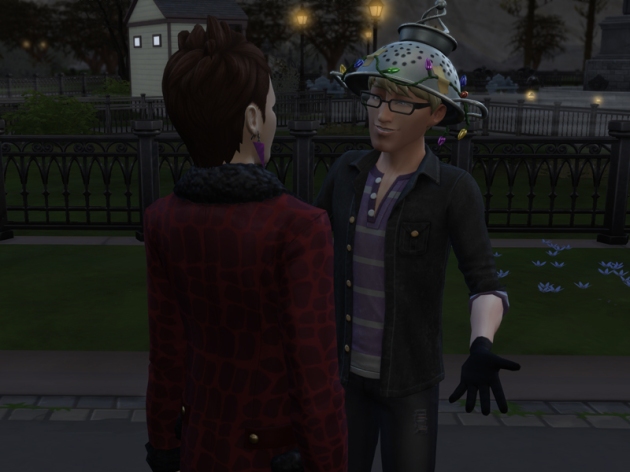 Boyd and Caleb having a friendly conversation with the Forgotten Hollow park in the background