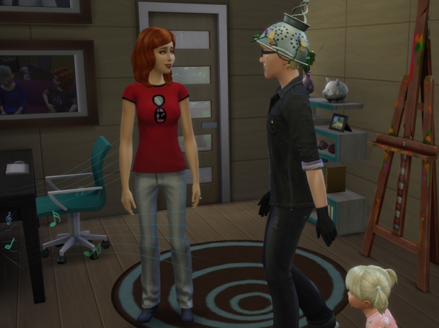 Boyd at home in the outfit with gloves and headgear while Susan and Blair both look at him